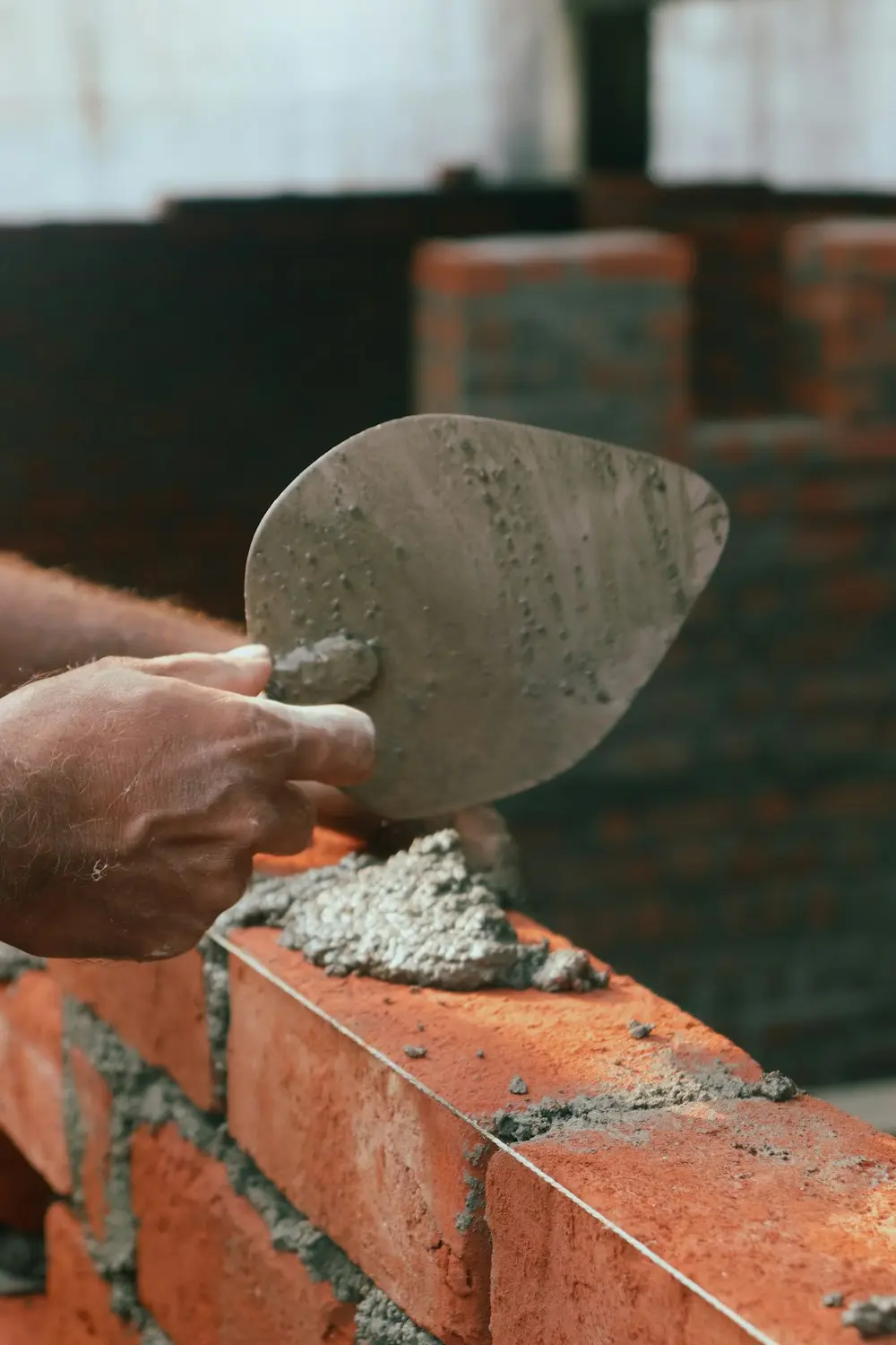 Bricklayer's trowel loaded with mortar