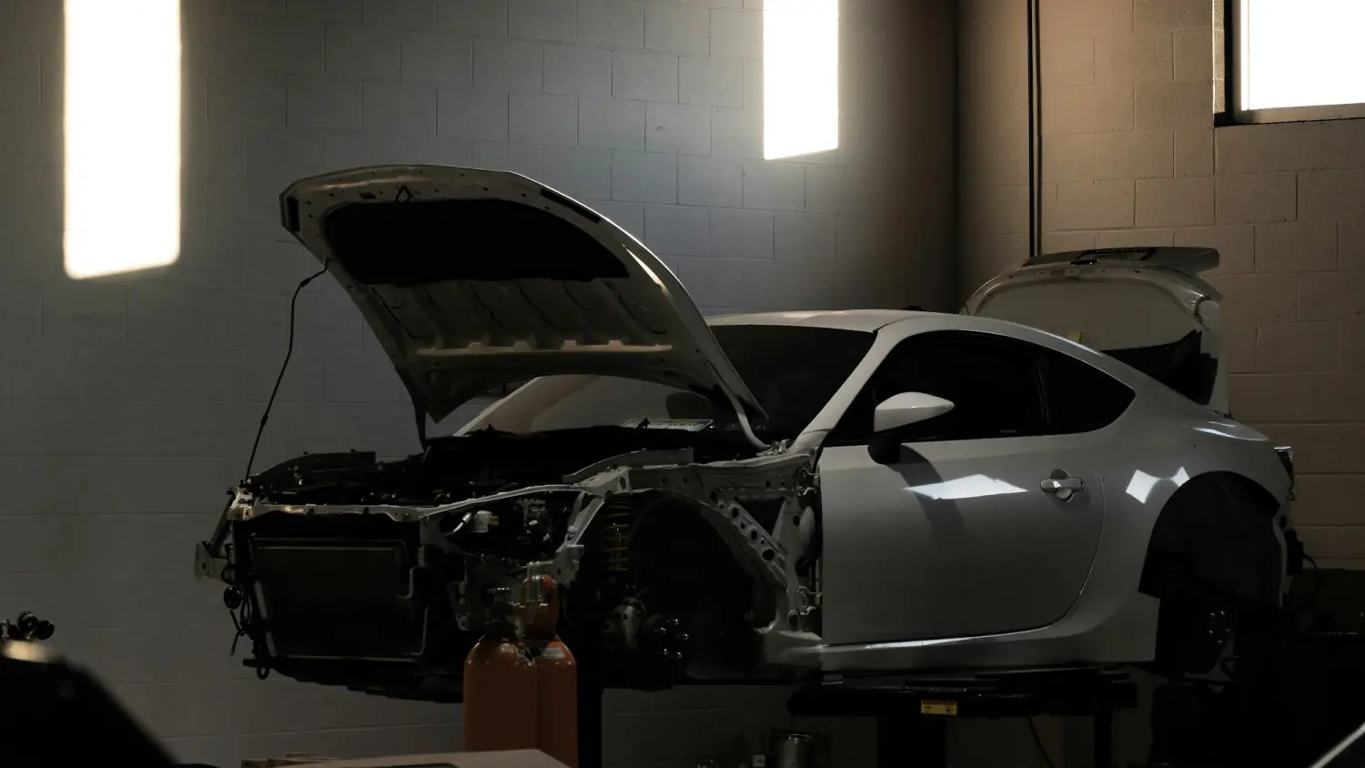 Sports car on the ramp with the bonnet open
