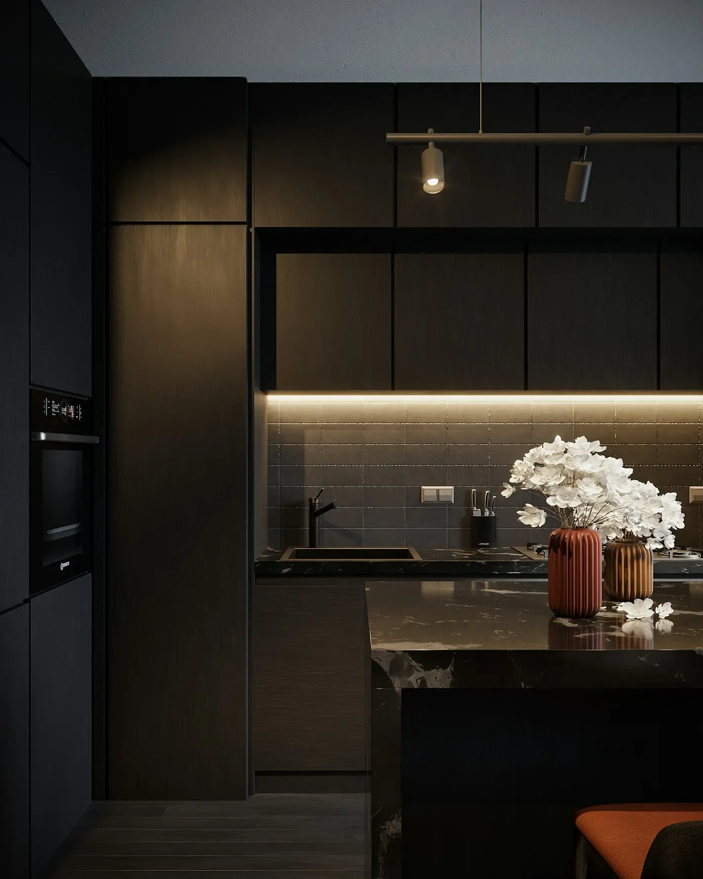 Dark timber kitchen with an island and under cabinet lighting