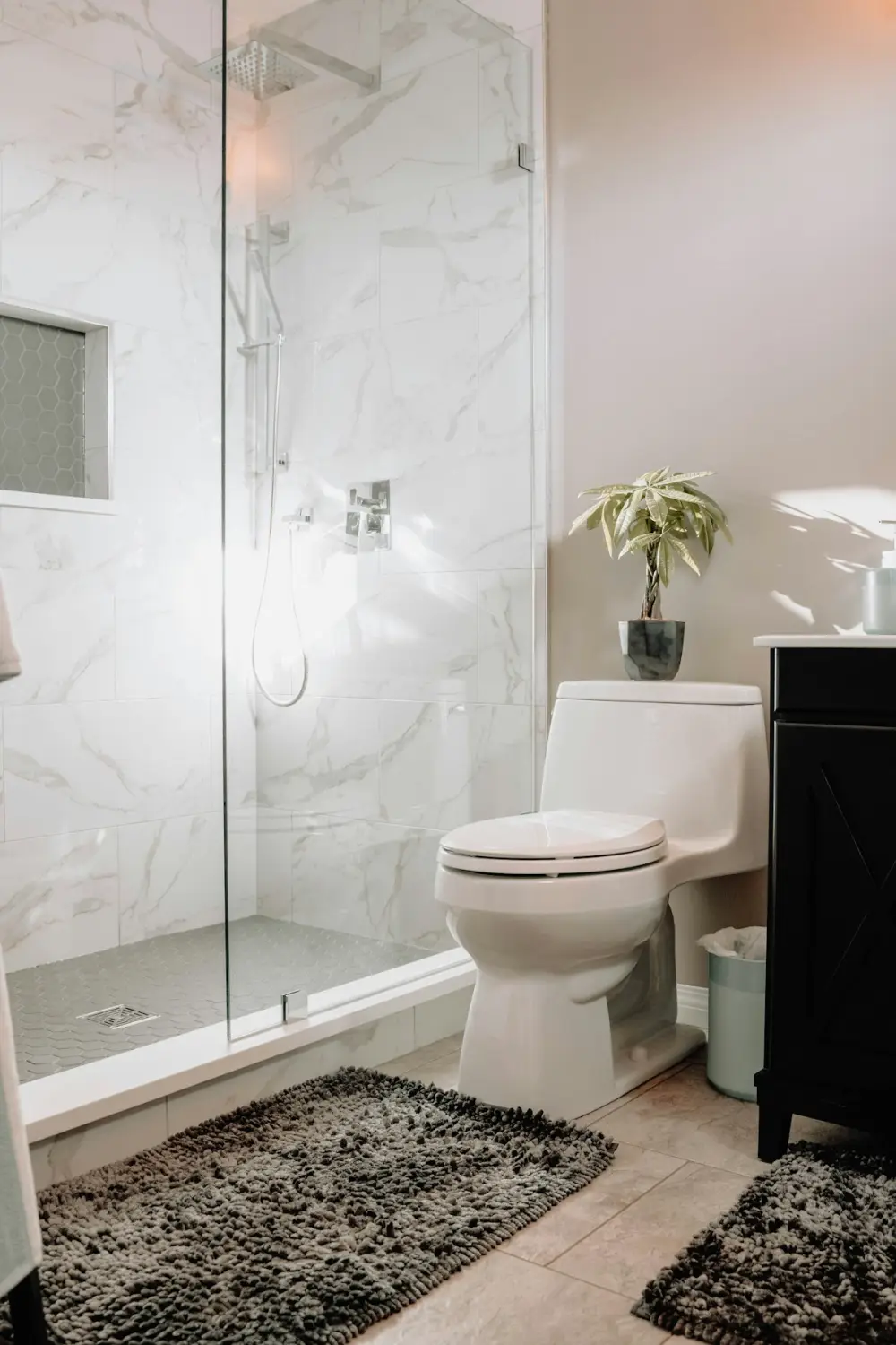 White marble en suite with glass shower