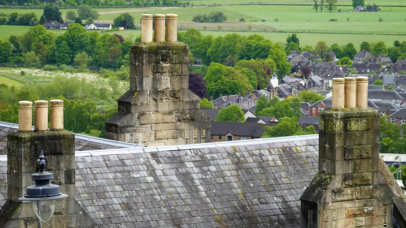 Restored chimney stacks on a slate roof