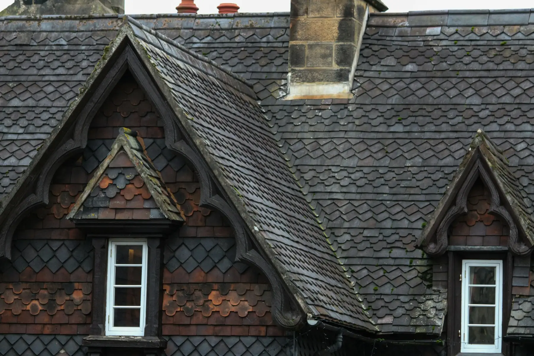 Slate roof with dormer windows and chimneys